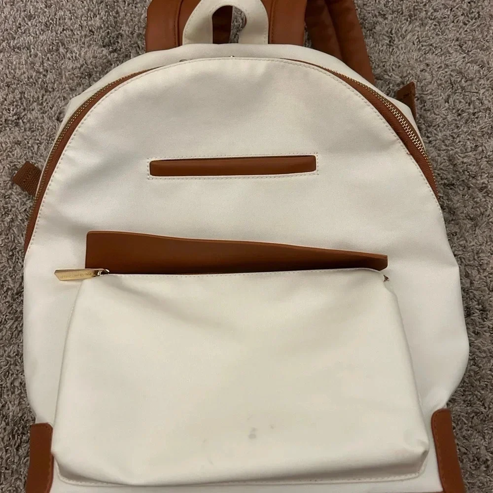 White and brown backpack